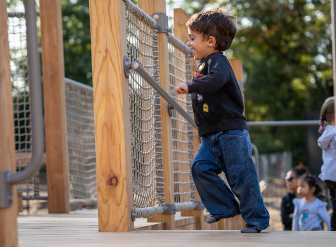 A child enjoys the Kempner Playground