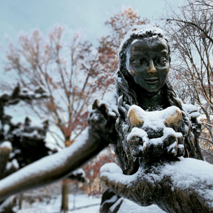 Alice in Wonderland statue in the snow