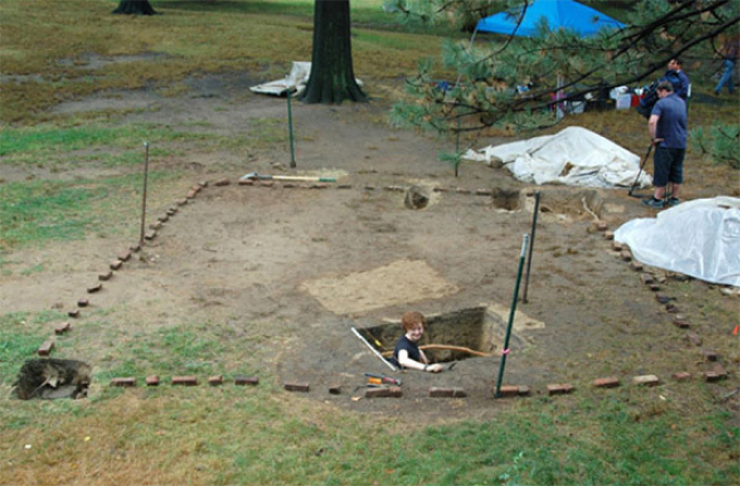Excavation site, with house footprint outlined in bricks